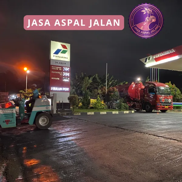 Proses pemadatan aspal menggunakan tandom roller